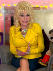 Dolly Parton sitting in a chair