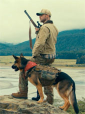 Brad Pitt and a beautiful German Shepherd in profile in a promotional image from Heart of the Beast