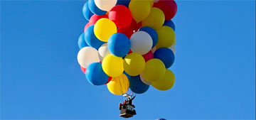 Balloon festival kicks off with man flying ‘Up’-inspired cluster of 94 balloons