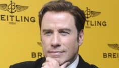 John Travolta forced to cut his trip short when Kelly goes   into labor (update)
