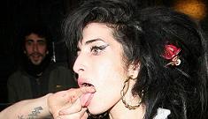 Amy Winehouse punches her own bodyguard