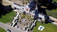 Tom Cruise to buy Neverland? Does Suri just have a birthmark?