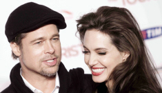 Angelina Jolie’s big hair, red lips, velvet jacket & silk pants in Rome