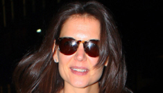 Katie Holmes flies solo in New York, looks unusually happy and fashionable
