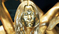 Kate Moss 18k gold statue complete with gold cameltoe on display