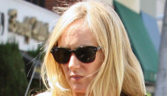 Kimberly Stewart shows off her growing bump in a rare photo op