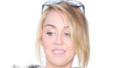 Miley Cyrus shows off her ring at LAX, isn’t planning her wedding any time soon