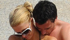 Paris Hilton thinks that if she cuddles a new guy while in a monokini we’ll pay attention