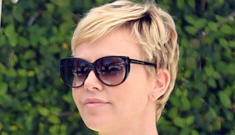 Charlize Theron looks sunny & smiley in a yellow top & skinny jeans: gorgeous?