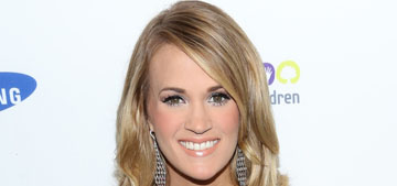 Carrie Underwood announces pregnancy with onesies on her dogs: cute?