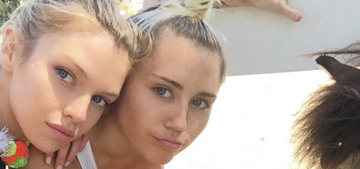 Miley Cyrus & Stella Maxwell made out as the paparazzi cheered: thirsty?