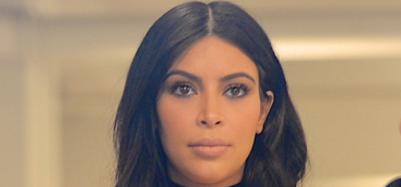 Kim Kardashian steps out in a leather mini, thigh-high boots: ridiculous?