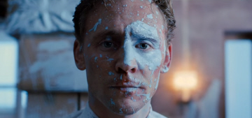 Tom Hiddleston is damaged & covered in paint in the new ‘High Rise’ trailer