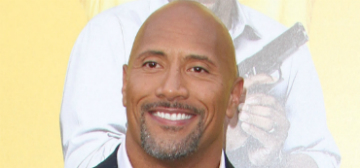 The Rock put his  baby daughter on his shoulders where she pooed on him
