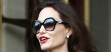 Angelina Jolie wore a caped coat to visit the Louvre with all six kids