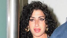 Amy Winehouse is back in the UK and she doesn’t look happy about it