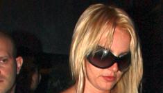 Britney Spears goes back to braless & blonde, flashes a diamond ring