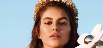 Kaia Gerber applies her perfume by spraying it on a mirror & using her finger