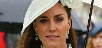 Duchess Kate repeated a pale, button-covered dress for a palace garden party