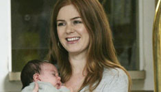 Sacha Baron Cohen and Isla Fisher with one month-old baby Olive