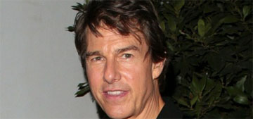 Tom Cruise helicoptered to the top of a cliff, greeted hikers & paraglided to the bottom