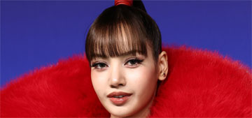 LISA wore a red furry oversized Quine Li cape at the 2026 MTV VMAs: muppet high fashion?