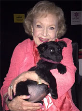 Betty White holding a dog