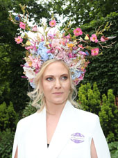 Woman at Royal Ascot wearing an intricate floral hat