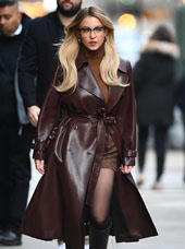 Sydney Sweeney in a cranberry leather trenchcoat in NYC